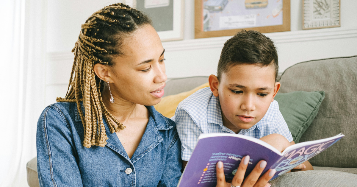 A woman and her child reading a book